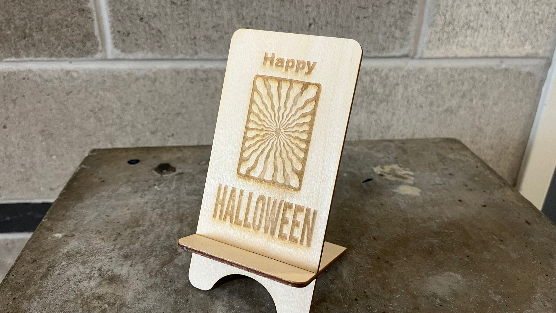 Our class was divided into groups to test laser printing for the first time using birch wood. We were given a shared template that one group member had to send to the Fab Lab. I chose a “Happy Halloween” design to match the season and added a random vector from Adobe Stock for decoration.