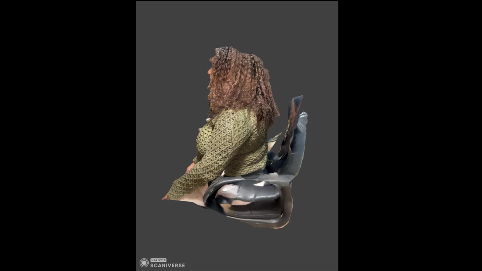 This is the side view of my seated 3D scan. You can clearly see how the chair and my hair scanned unevenly, showing missing geometry on the edges.