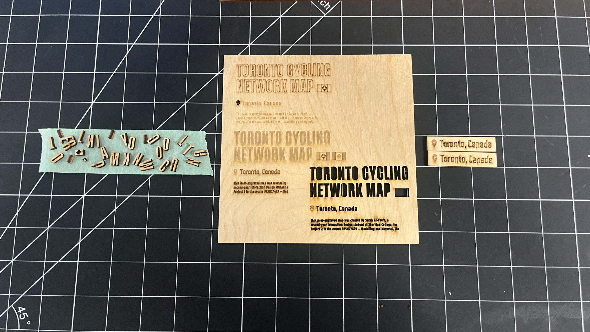 This photo shows my text layout tests for the Toronto Cycling Network Map project. I tried multiple text placements and font sizes before finalizing the one I would engrave for the laser-cut map.