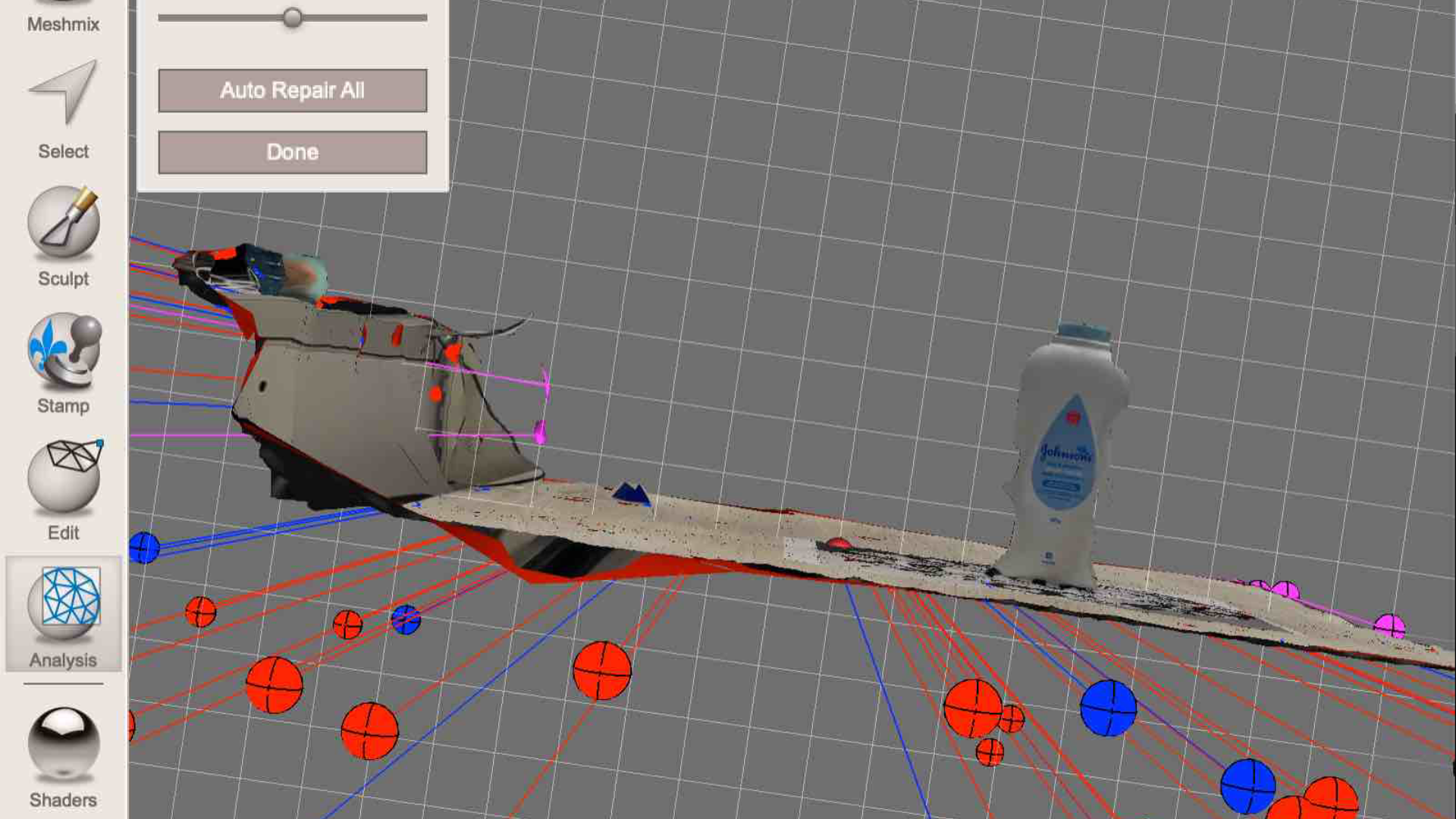 This screenshot shows the auto-repair tool analyzing the broken scan that includes the baby powder bottle. The colored spheres mark holes, weak geometry, and areas needing repair.