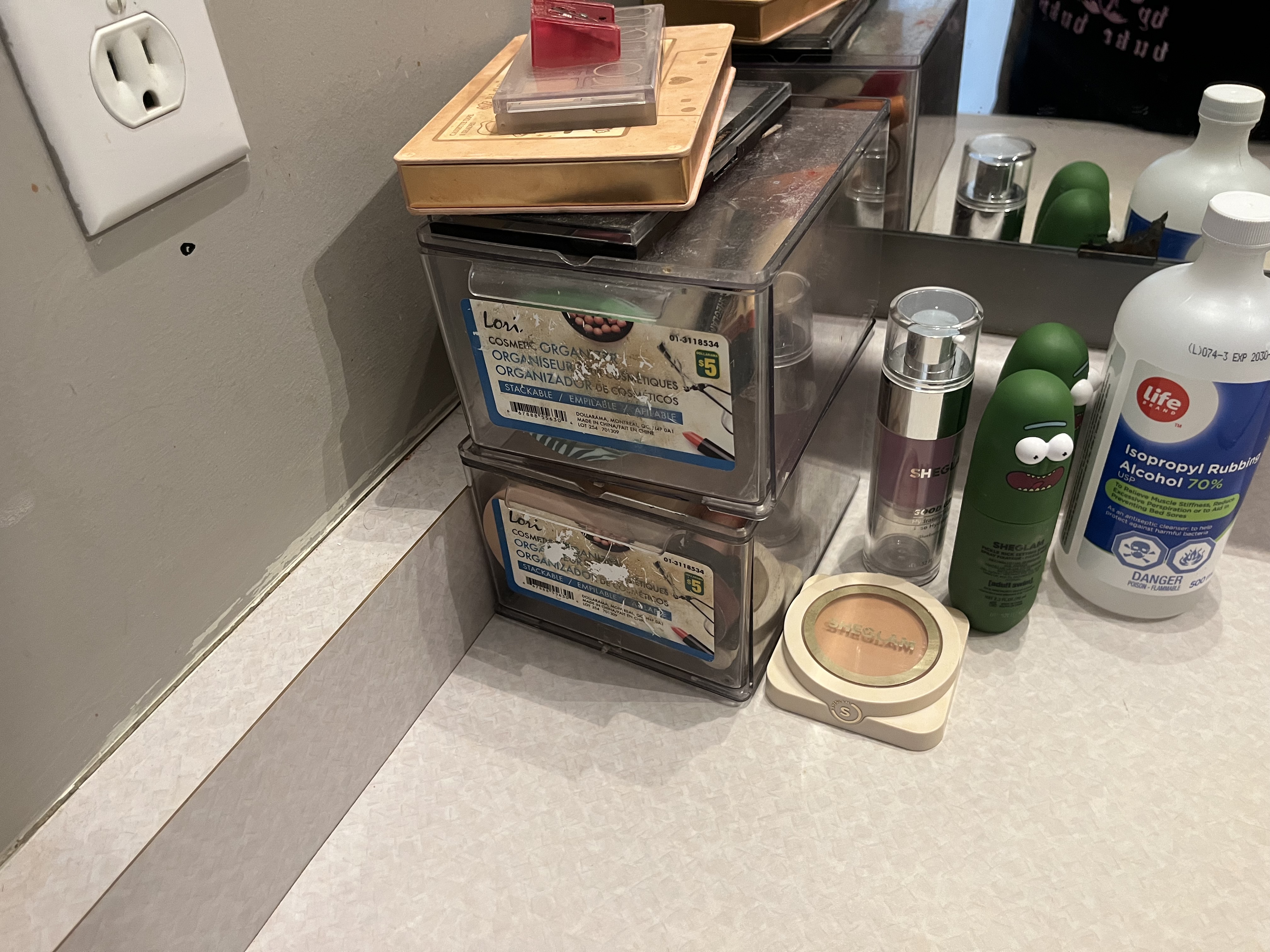 This is the sound of the make-up drawer set being opened and then shut, with a light sliding motion followed by a soft close.