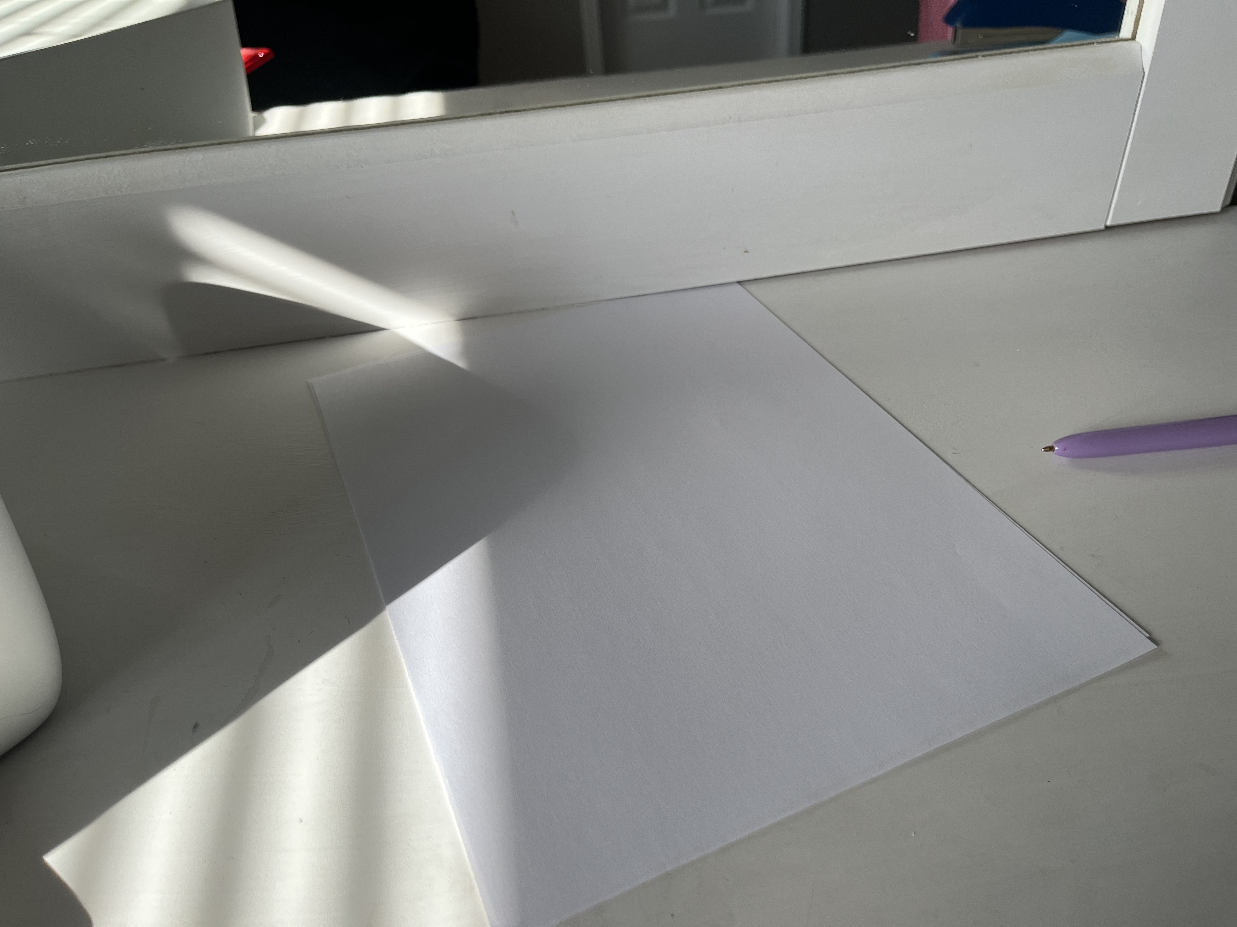 This is the sound of a stack of papers being shuffled, creating a soft, quick rustling noise as the sheets slide against each other in rapid, light movements.